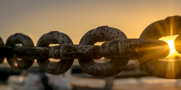 Chain links with sunset behind